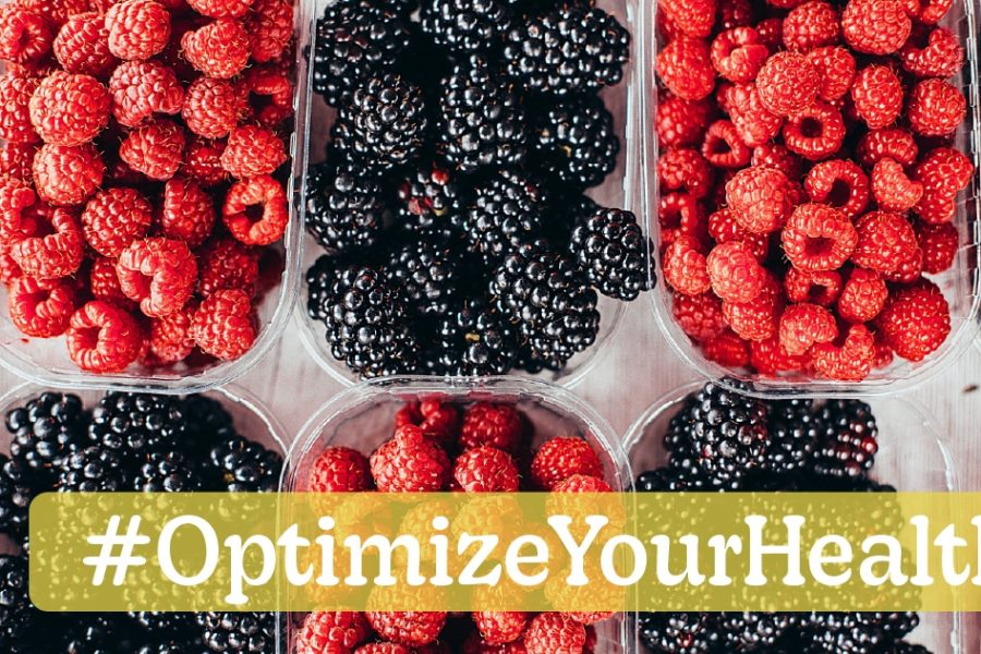 Fresh raspberries and blackberries in clear containers with #OptimizeYourHealth overlay, promoting health benefits of berries.