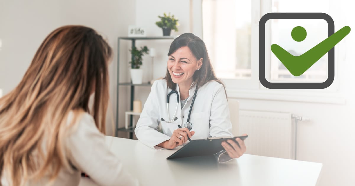 Doctor consulting with patient in a bright office, discussing health benefits and wellness rewards related to SelectHealth insurance.